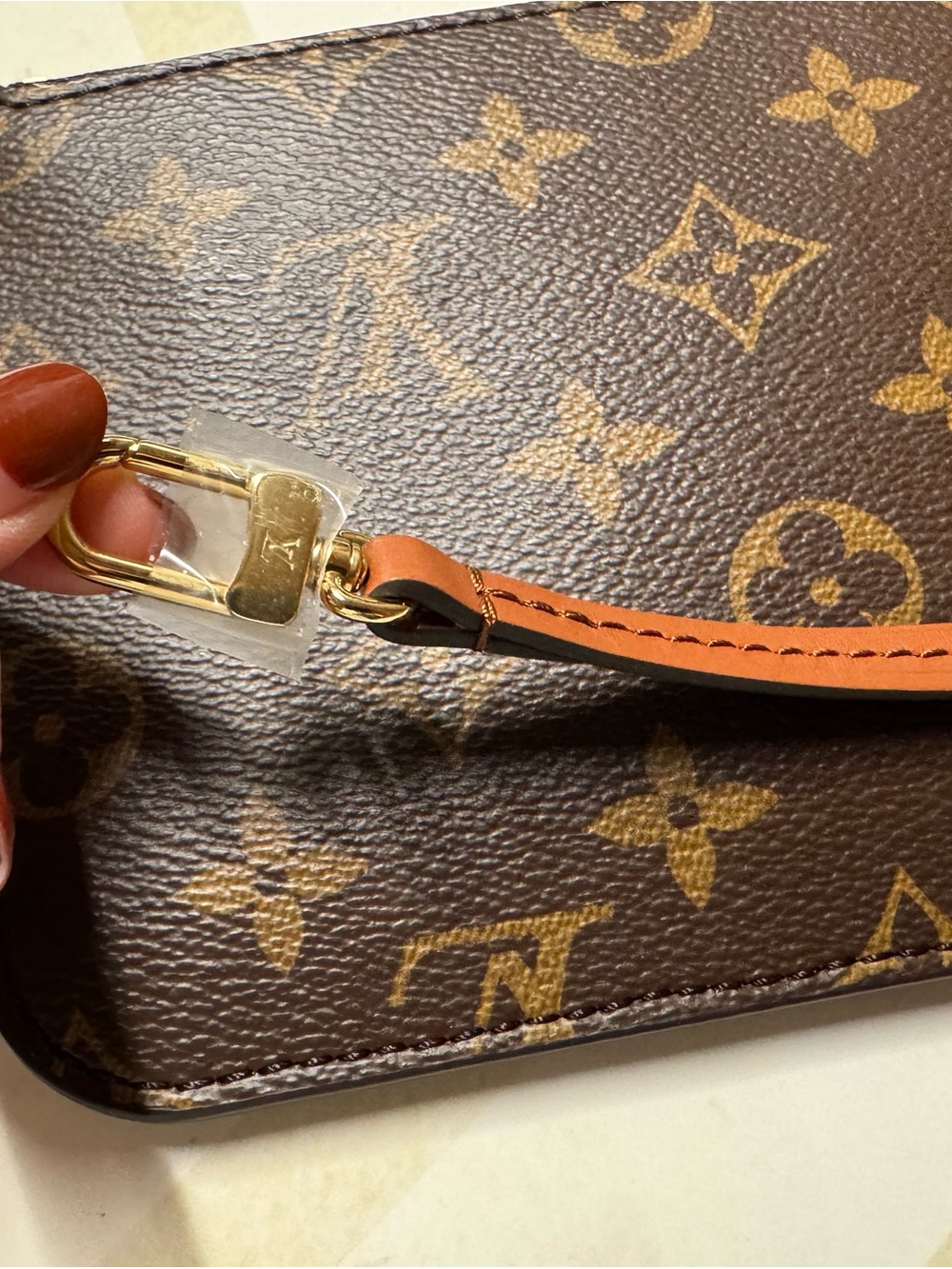 Louis Vuitton Brown Monogram Wristlet with Tan Leather Strap and Gold Hardware